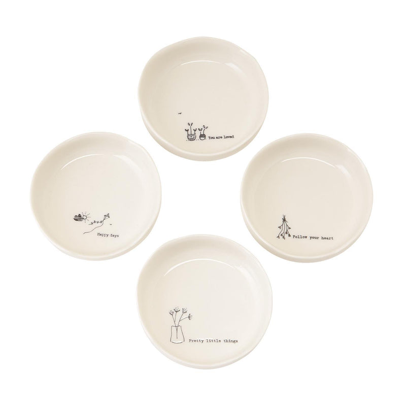 Set of four small ceramic bowls with decorative inscriptions on a white background