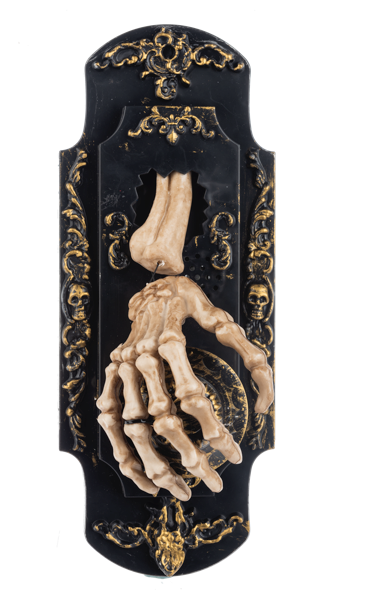 A gothic Halloween wall plaque featuring a 3D skeletal hand reaching over a clock face, mounted on an ornate black and gold plaque with skulls and baroque details.