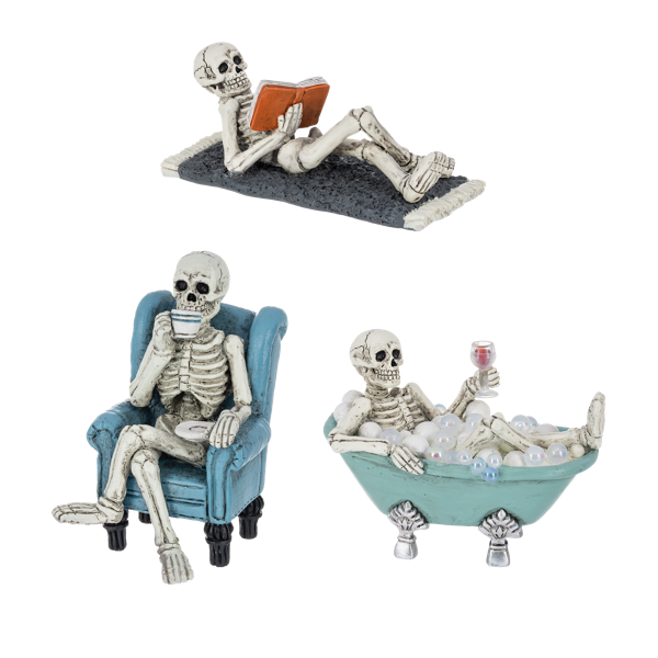 Three skeleton figurines in different poses on a white background