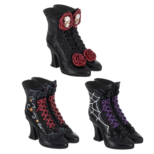 Black high-heeled boots with decorative elements on a white background