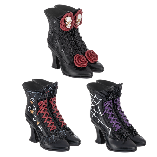 Black high-heeled boots with decorative elements on a white background