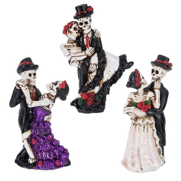 Three skeleton figurines in formal attire with decorative elements on a white background