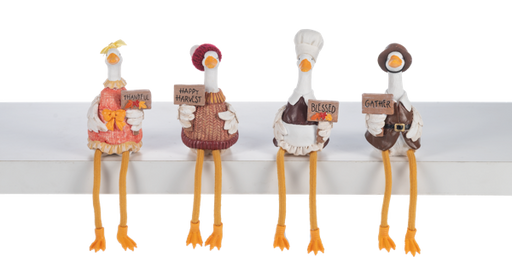Four decorative goose figurines with signs on a white background
