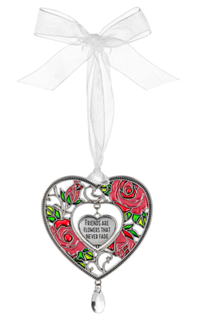 Heart-shaped ornament with roses and a white ribbon on a white background
