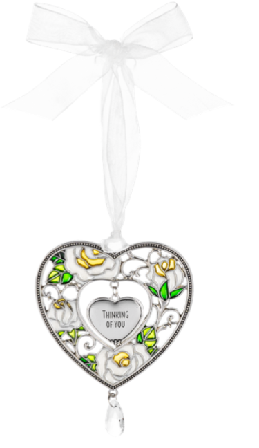 Decorative heart-shaped ornament with floral designs and 'Thinking of You' message on a white background