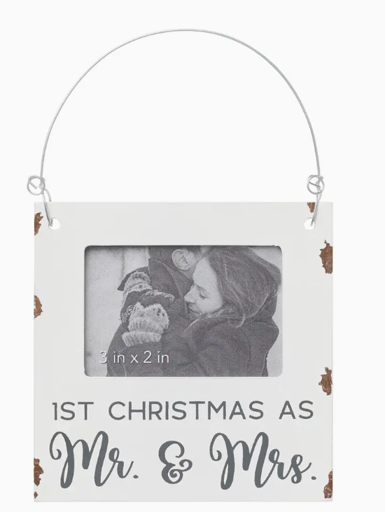 Hanging photo frame with '1st Christmas as Mr. & Mrs.' text on a white background