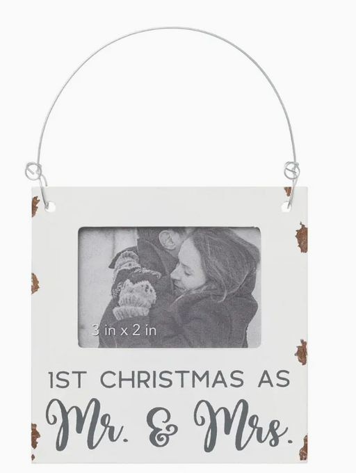 Hanging photo frame with '1st Christmas as Mr. & Mrs.' text on a white background