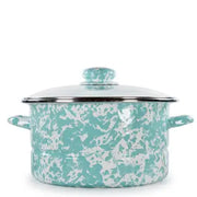 Turquoise and white patterned cookware with lid on a white background