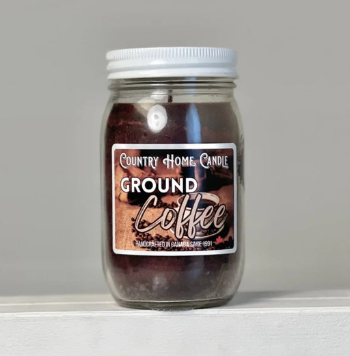 Jar of ground coffee with a label on a gray background