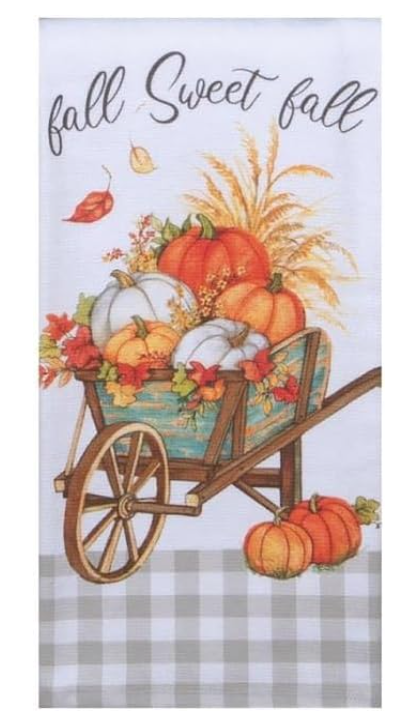 Decorative towel with pumpkins, corn, and 'fall sweet fall' text on a checkered background