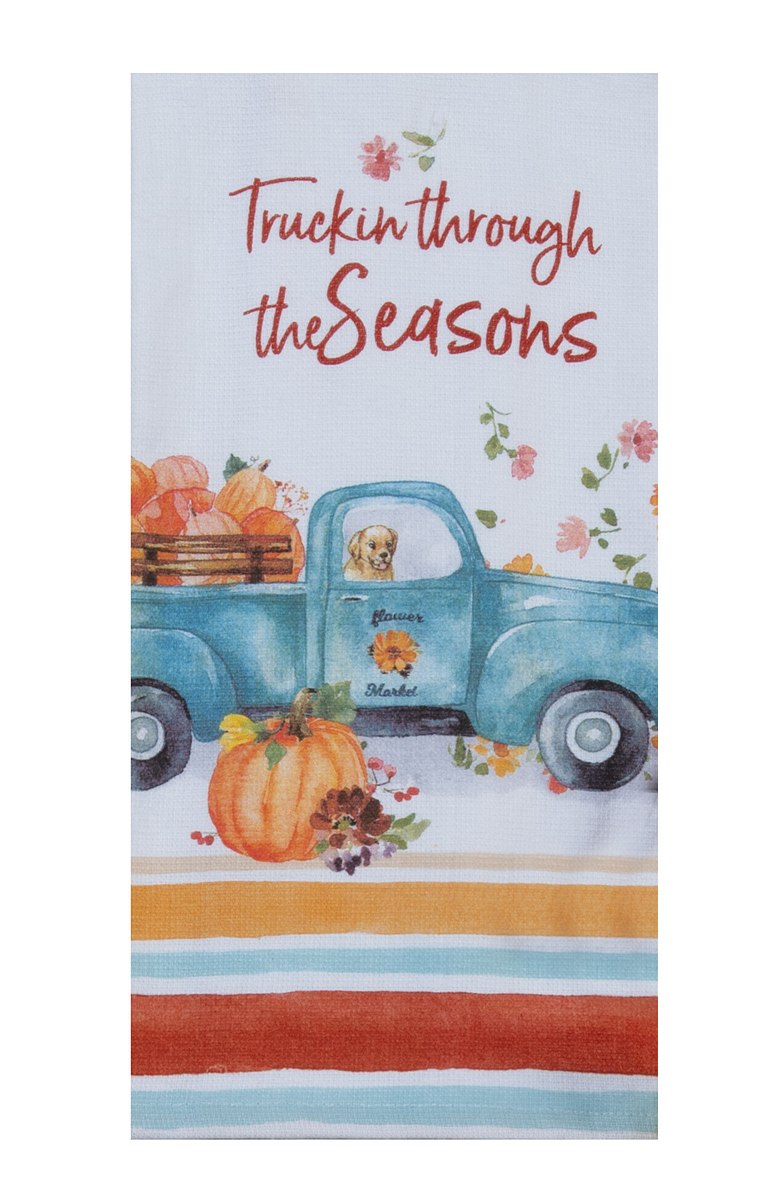Tea towel with a blue truck and pumpkins design, featuring the text 'Truckin through the Seasons'.