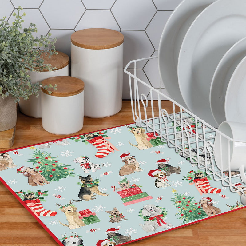 Christmas-themed kitchen mat with dog illustrations on a wooden floor.
