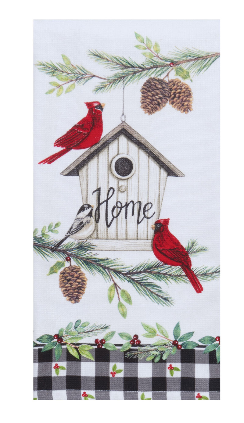 Decorative kitchen towel with cardinals, birdhouse, and pinecones on a white background