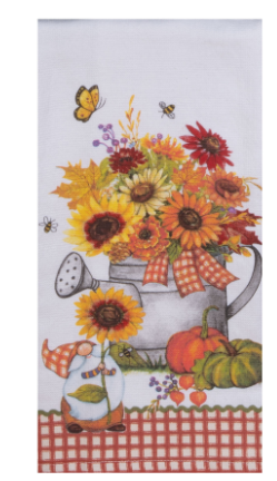 Decorative towel with autumn-themed design featuring sunflowers, pumpkins, and a watering can.