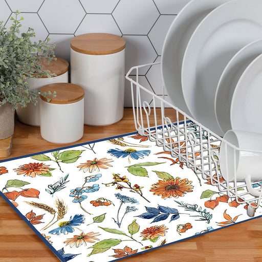 Floral patterned rug on a wooden floor with a dish rack and decorative items in the background.