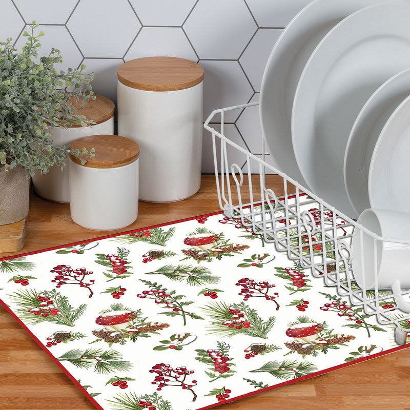 Decorative kitchen rug with Christmas design on a wooden floor, next to a dish rack and storage canisters.