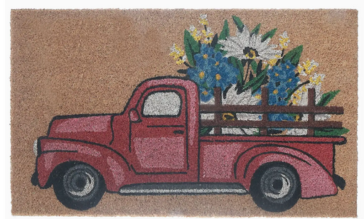 Doormat with a red truck carrying flowers on a beige background