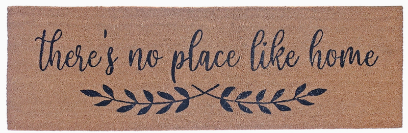 Doormat with 'there's no place like home' text and leaf design on a brown background