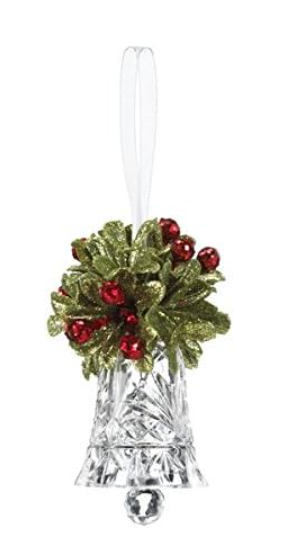Decorative glass bell with greenery and red berries on a white background