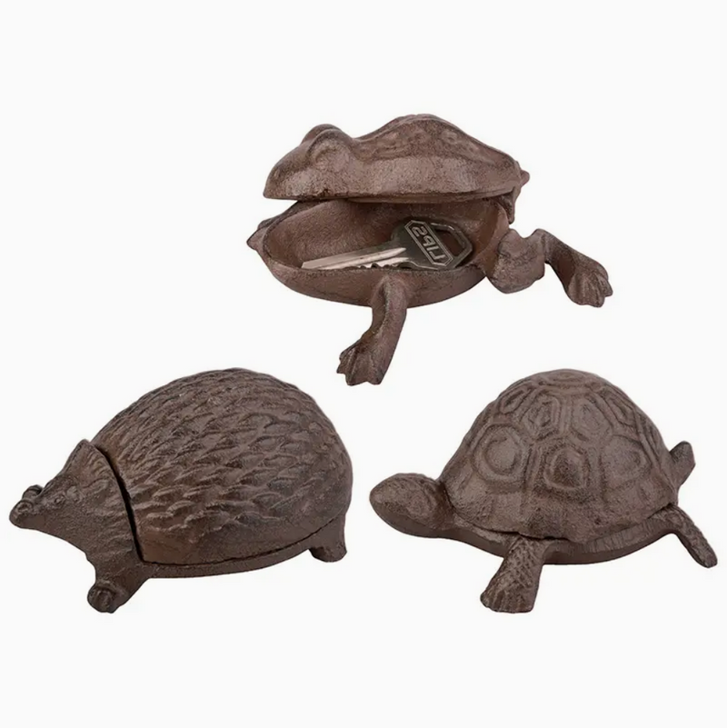 Three cast iron animal-shaped figurine on a white background