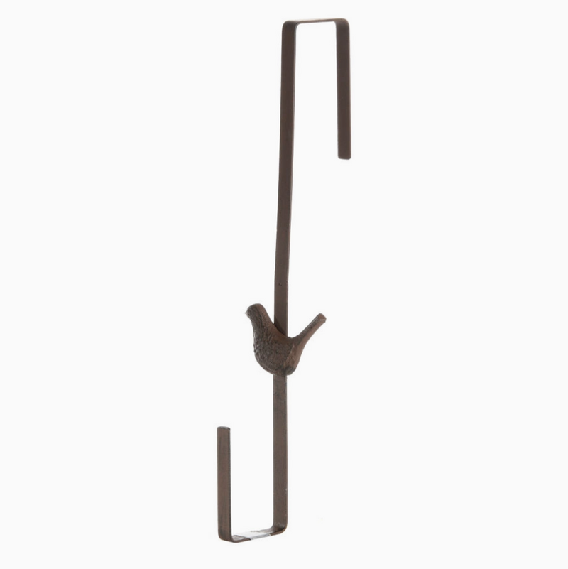Decorative metal hook with bird design on a white background