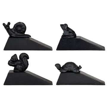 Set of four black animal-shaped door stoppers on a white background