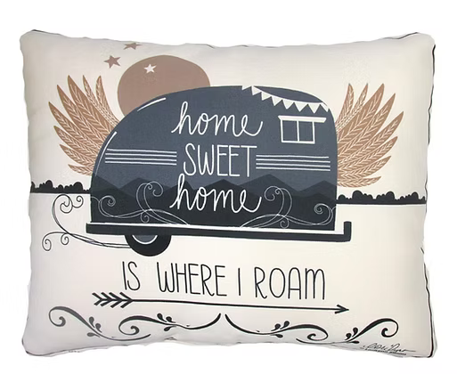 Decorative pillow with camper design and text on a white background