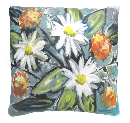 A square decorative pillow with a floral design, featuring white and orange flowers on a blue background.