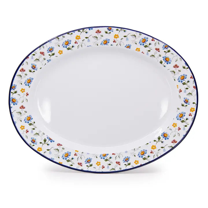 White ceramic plate with floral decorative rim on a white background