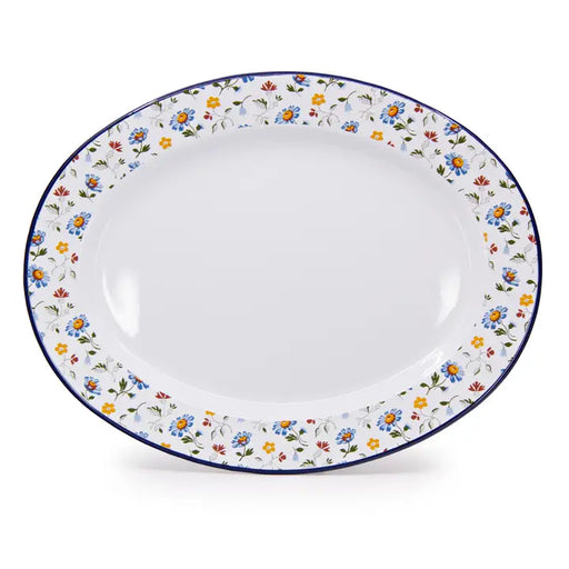 White ceramic plate with floral decorative rim on a white background
