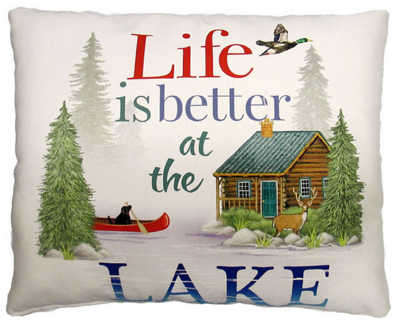 Decorative pillow with a cabin, trees, and 'Life is better at the Lake' text.