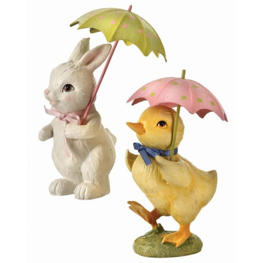 Decorative figurines of a rabbit and duck holding umbrellas on a white background