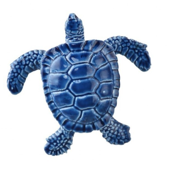 Blue turtle figurine on a white background