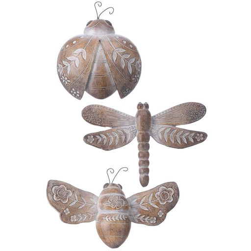 Decorative wall art of a butterfly and a dragonfly with floral patterns on a white background