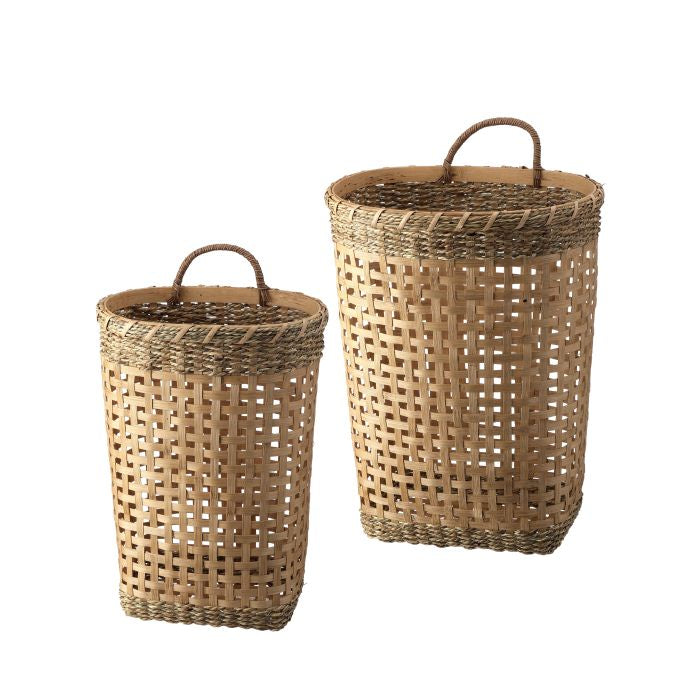 Two woven baskets with handles on a white background