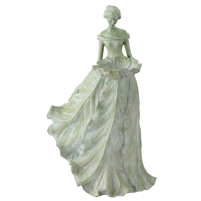Statue of a woman in a flowing dress on a white background