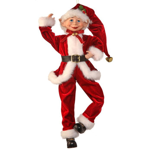 Decorative Christmas elf figurine in a red suit with white fur on a white background