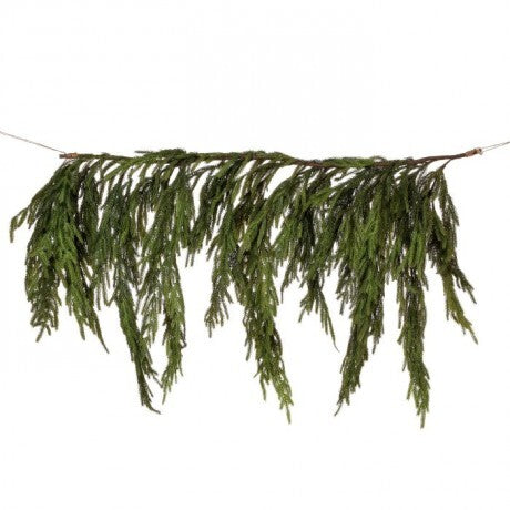 Artificial greenery branch on a white background