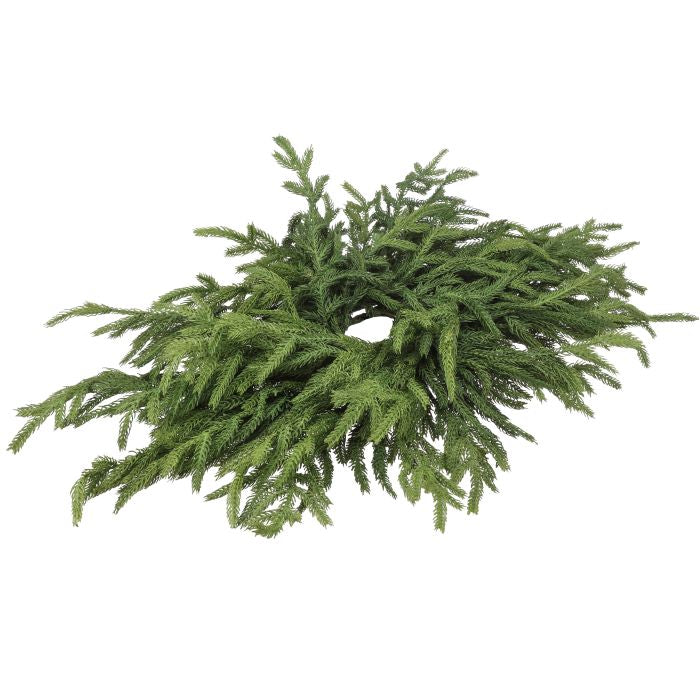 Green artificial wreath on a white background