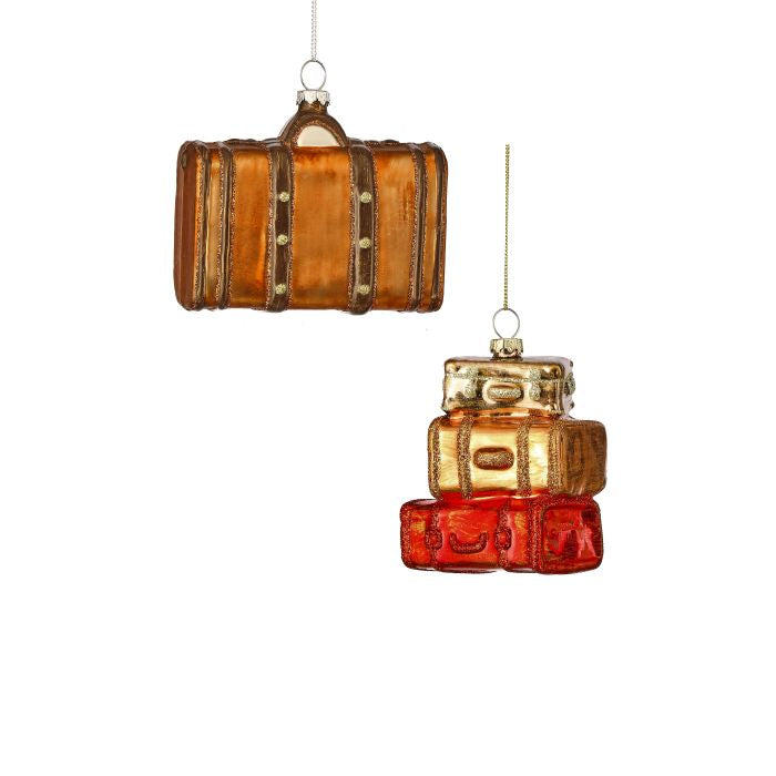 Decorative glass suitcases on a white background