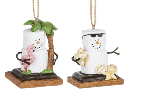 Two S'mores coastal ornaments, one with a pink flamingo and the other with shells, each mounted on a wooden base with a 'S'mores character.