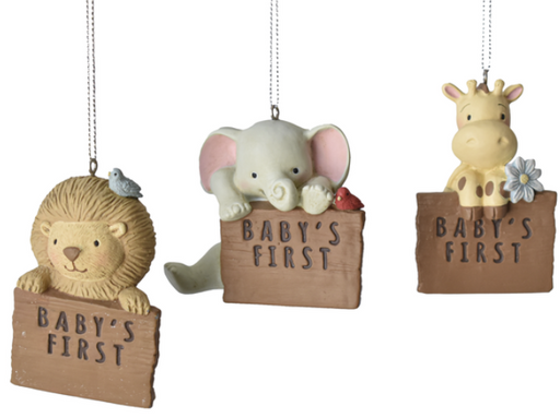 Three decorative ornaments featuring a lion, elephant, and giraffe with 'Baby's First' text on wooden blocks.