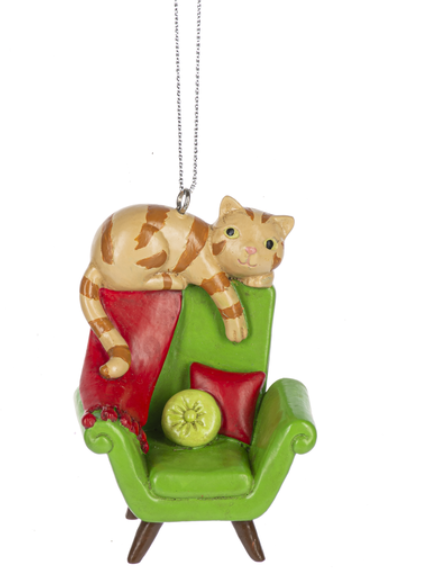 Cat on a green chair ornament with a white background