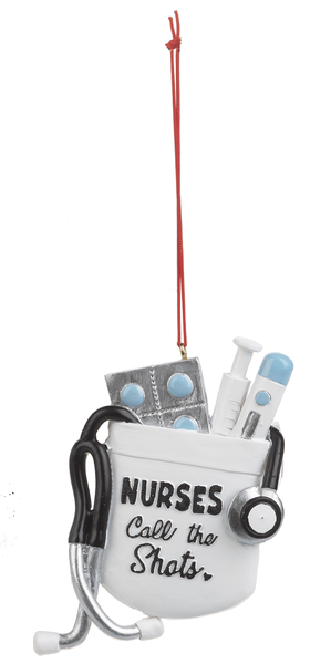Decorative ornament with stethoscope, syringes, and 'Nurses Call the Shots' text on a white background