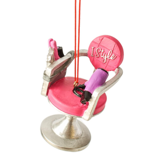Pink high heel shoe with makeup tools on a white background