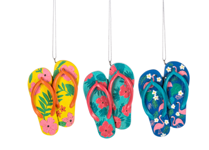 Colorful flip-flop decorations with floral and flamingo patterns on a white background