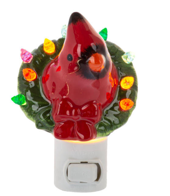 Cardinal-shaped night light with a wreath on a white background