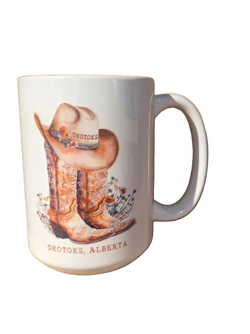 Mug with a cowboy boot and hat design on a white background