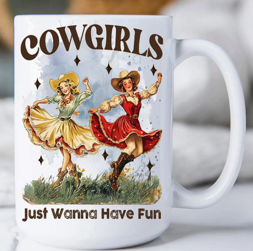 Mug with cowgirl design and text 'Cowgirls Just Wanna Have Fun' on a white background