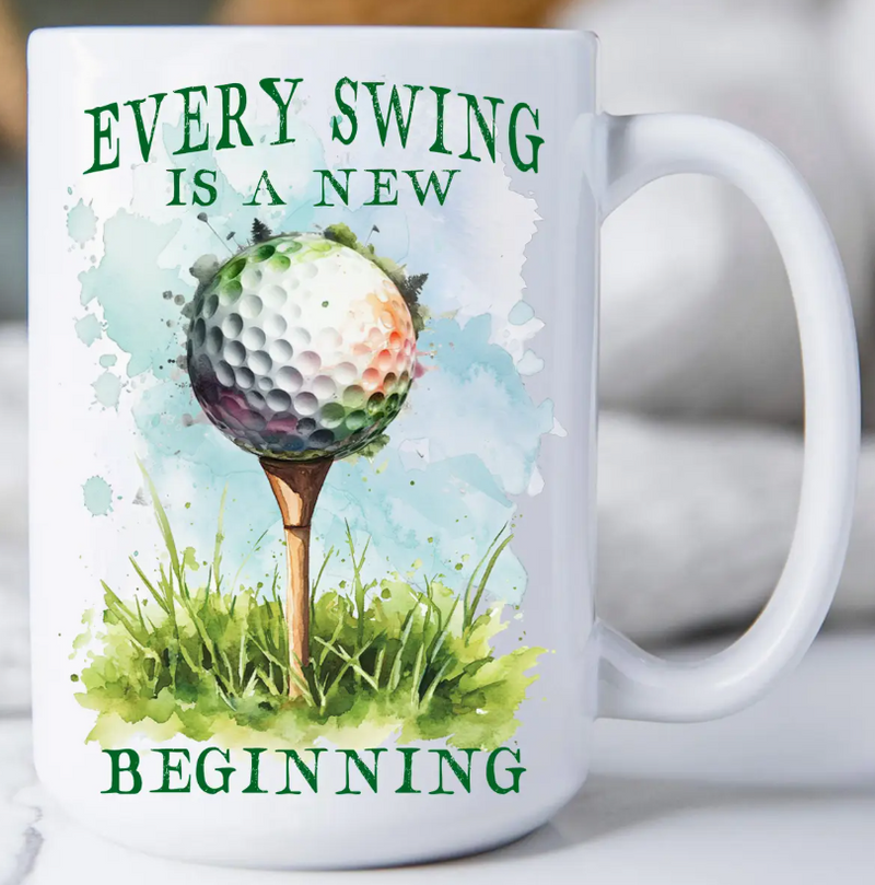 Mug with golf ball design and text 'Every Swing is a New Beginning' on a white background